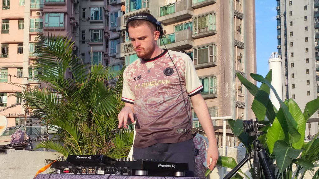 DJ Waisty spins his liquid drum and bass set on a rooftop in Kowloon City 